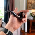 smoking a pipe at home