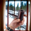 large wood pipe in the hand of mr bróg